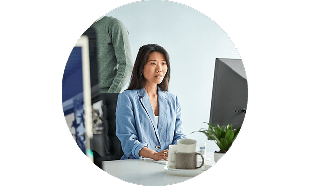 Woman sitting in office working on her computer
