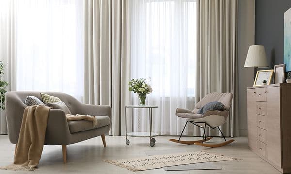 Straight curtains hanging in a Nordic living room