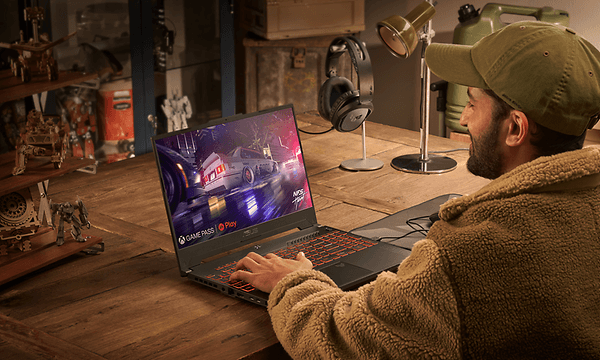 Man with a beard gaming with ASUS TUF A15 laptop