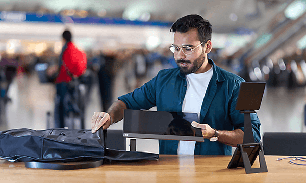 Espresso Displays - Man packing his Espresso D15 display in his bag - Built for travel