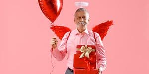 Old man celebrating valentine's day with cute outfit and heart balloon