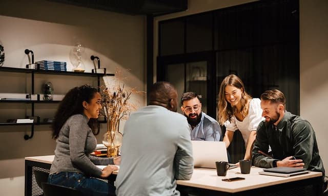 A group of people working together in a meeting