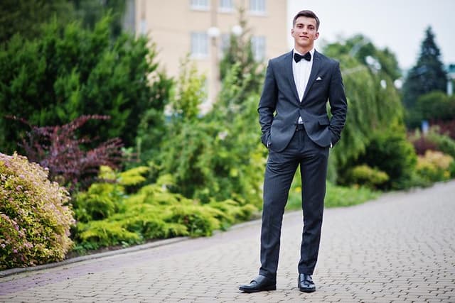 Boy dressed up in suit for celebration day