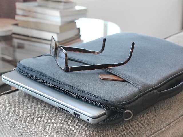 Computing - Accessories - Laptop in a grey laptop case on a table