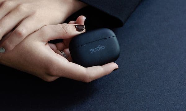 Female hand holding black Sudio D1 Pros