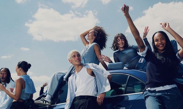 Bose Soundlink Plus on roof of car with young people around