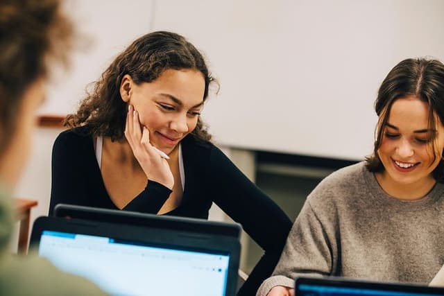 Computing - AI PC - Young women using laptops while studying