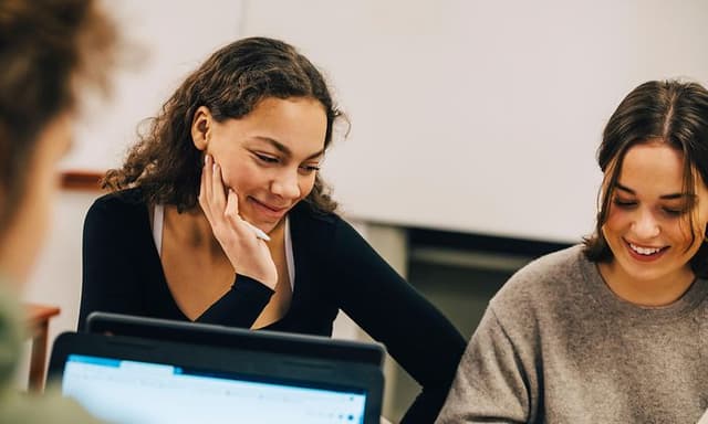 Computing - AI PC - Young women using laptops while studying