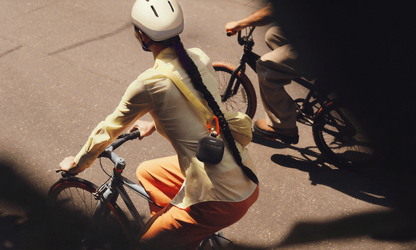 Bose-soundlink-micro- woman with speaker rides bike