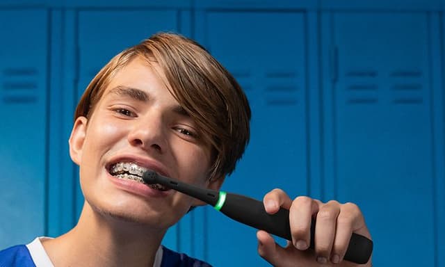 Boy brushing his teeth