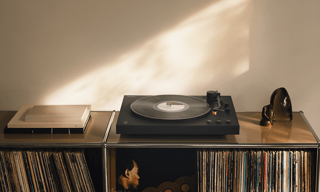 Sony LX5BT turntable on top of a bookshelf full of vinyls