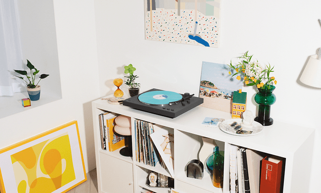 Sony LX3BT turntable on a bookshelf with a blue vinyl