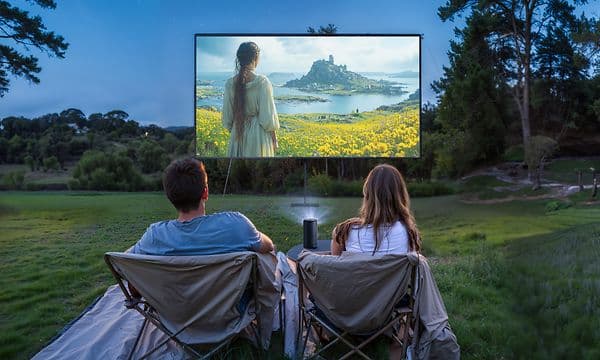 Capsule 3 - Couple watching projected movie outside