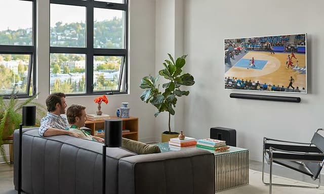 Sonos-black-speakers-men-watching-basketball-on-screen