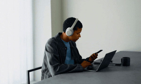 Sony WH-1000XM4C- man in office with laptop